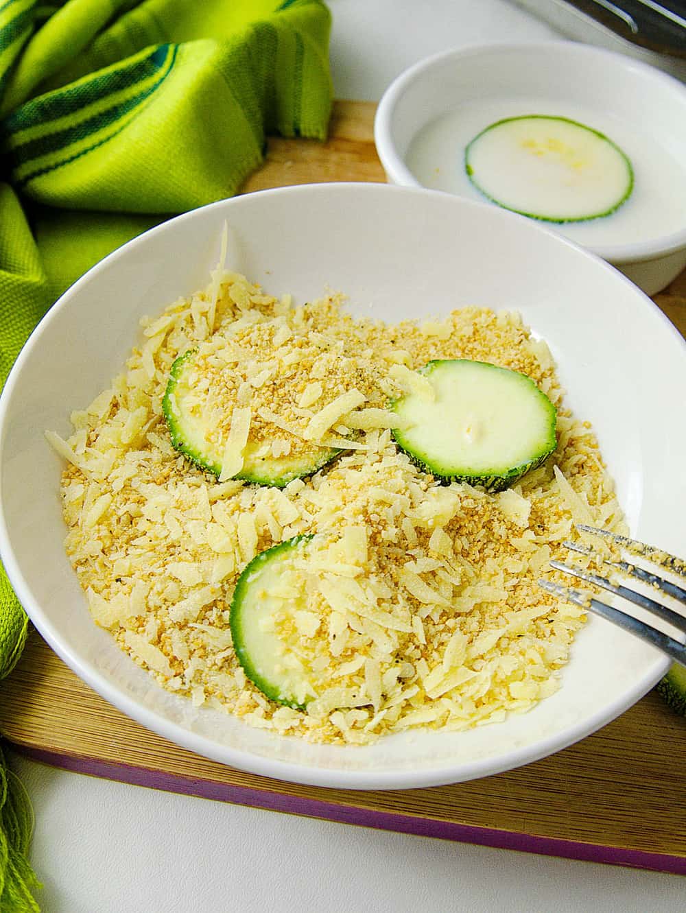 sliced zucchini going into the batter