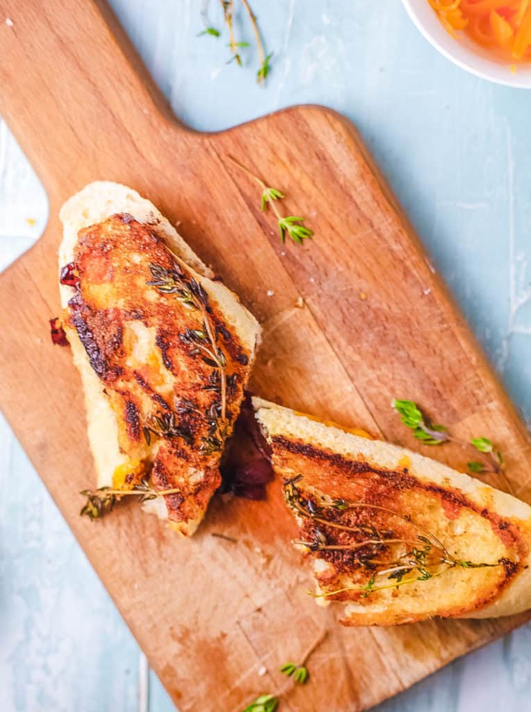 top view of garlic bread grilled cheese on a wooden cutting board