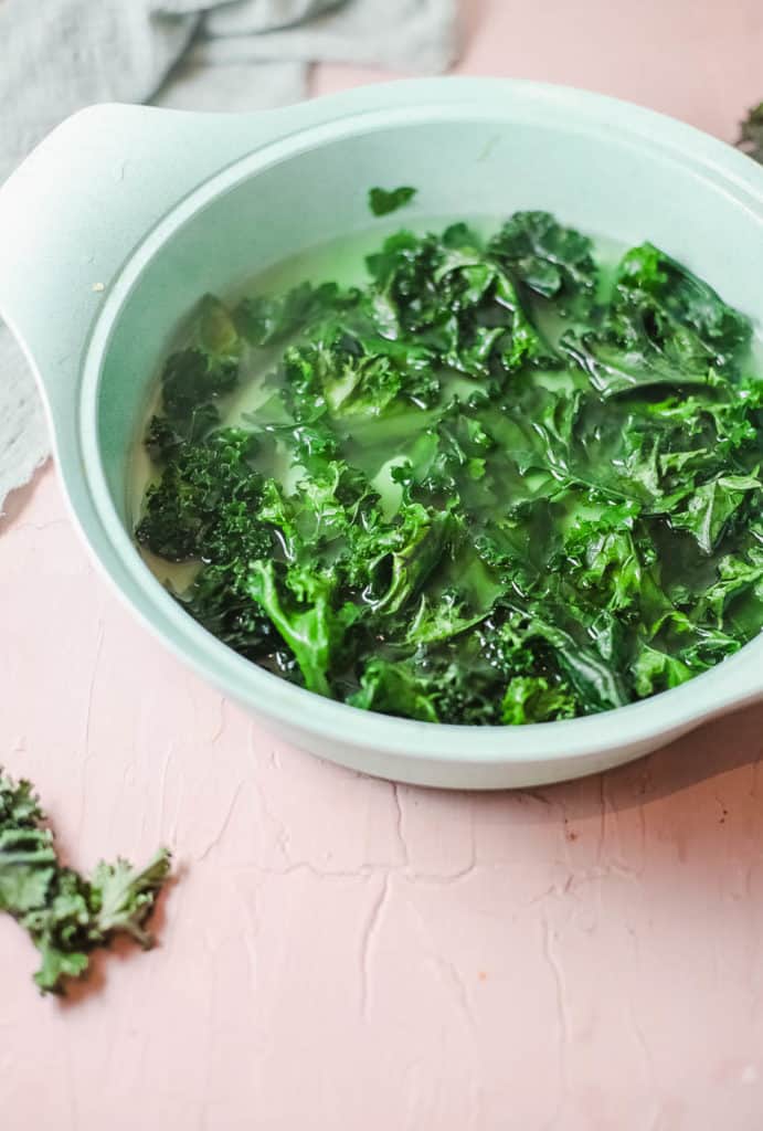 kale steaming in a pot with water