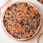 cherry crumble pie against a white background, top view