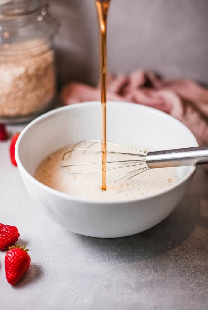 maple syrup being added to batter