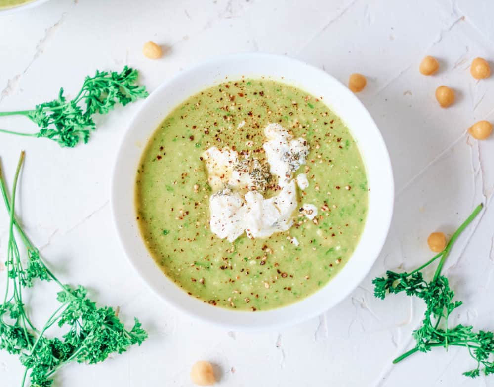 IMG_5029 asparagus and leek soup with herbed goat cheese served in a white bowl
