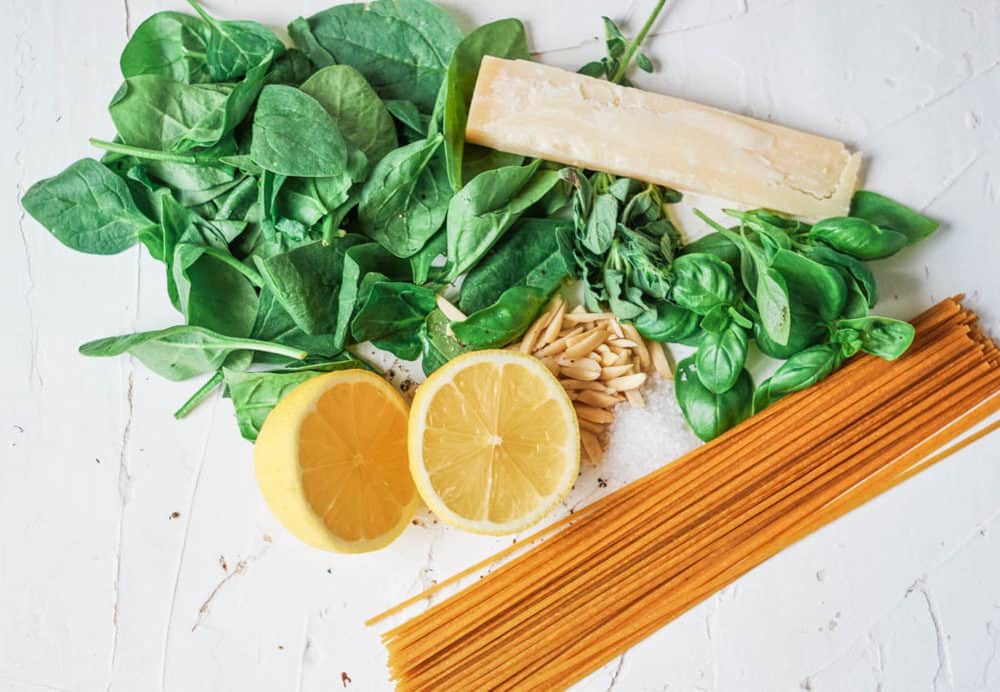 ingredients for recipe - spinach, lemon, herbs, pasta, cheese
