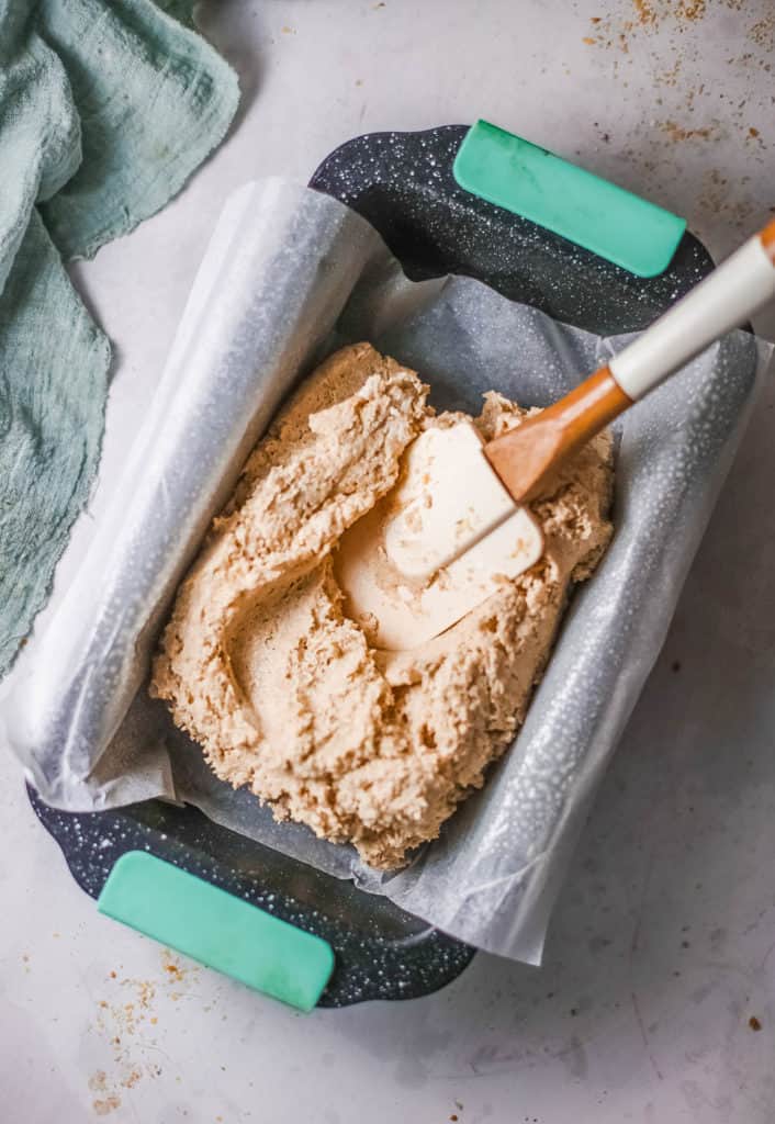 bread dough being added to pan