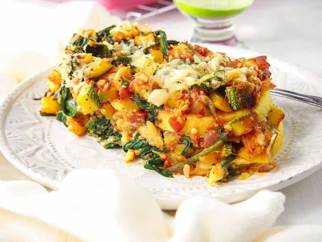 Vegetarian polenta lasagna served on a white plate.