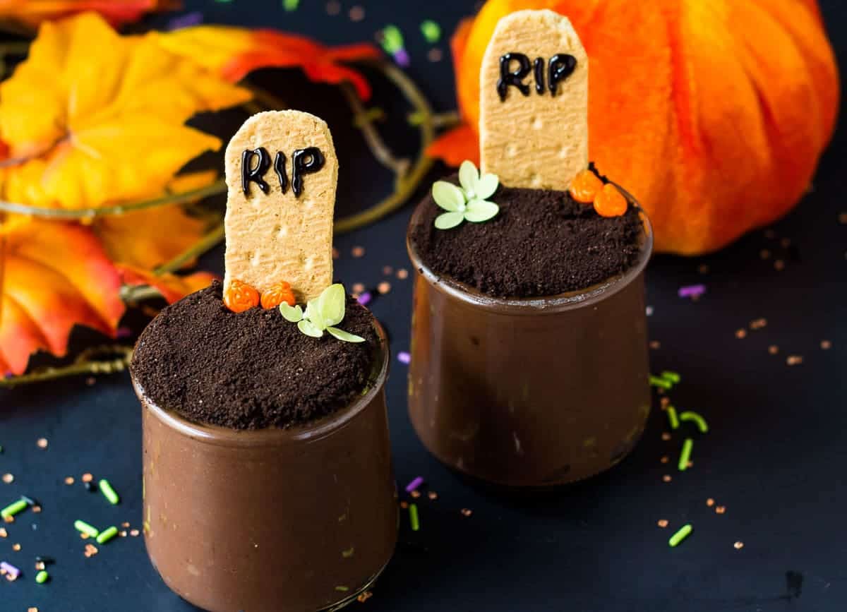 Two Halloween graveyard pudding cups.
