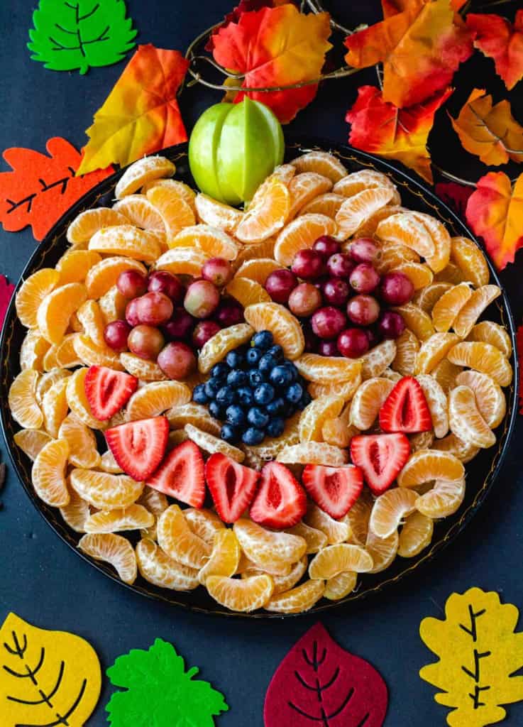 pumpkin face fruit tray with oranges