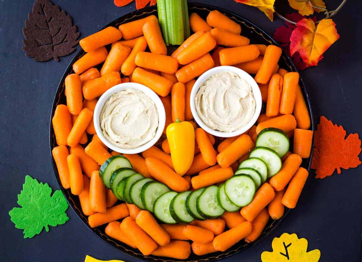 pumpkin veggie tray with carrots and cucumbers