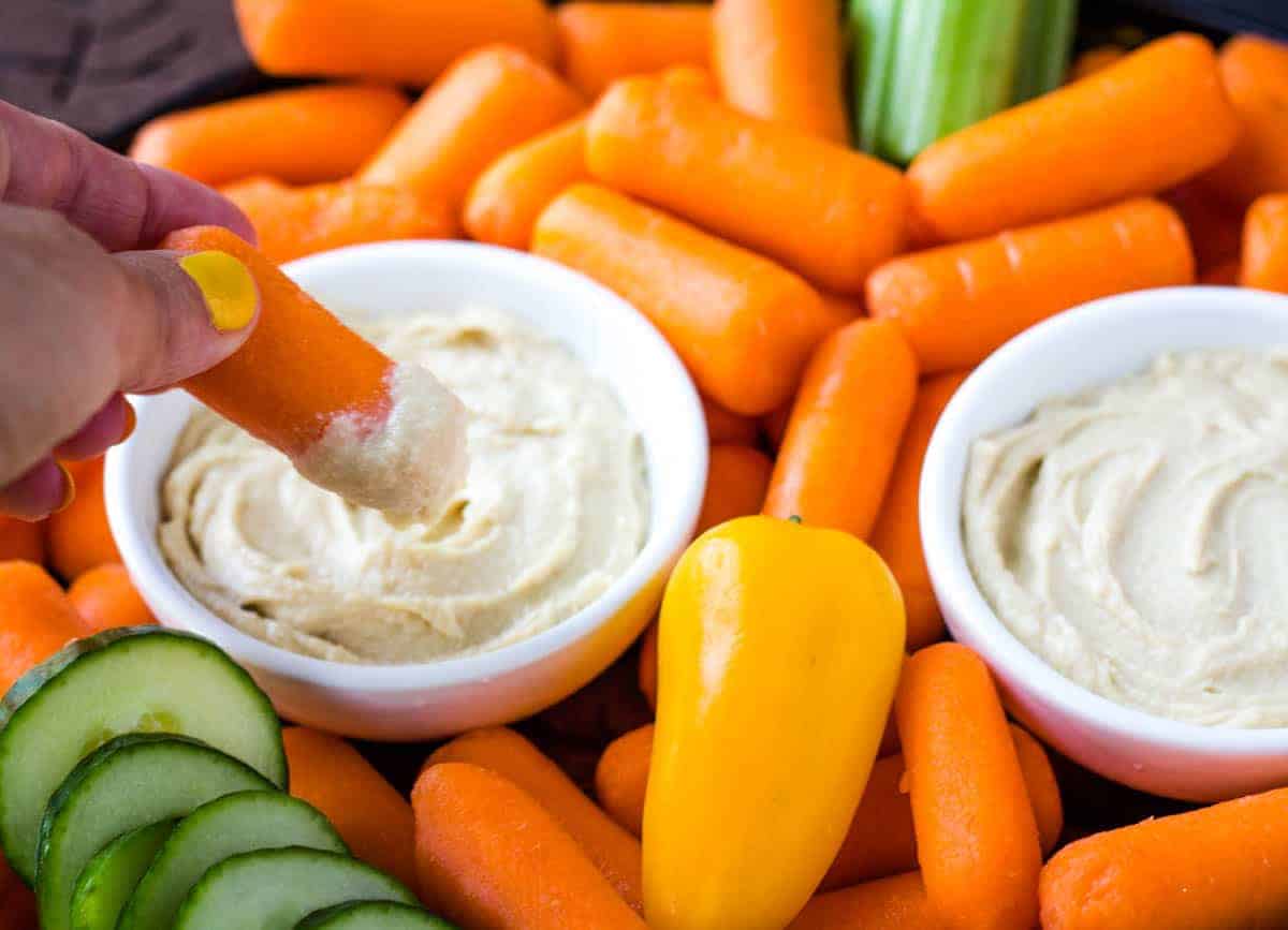 carrot dipped in hummus