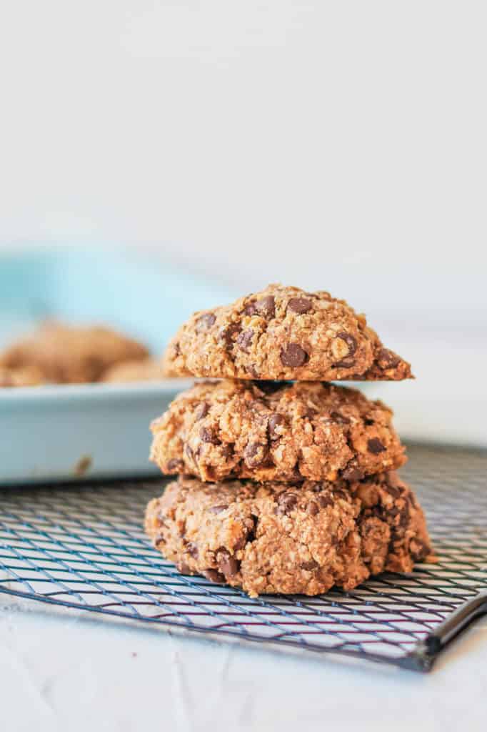 Vegan Oatmeal Cookies with Chocolate Chips stacked on a wire rack