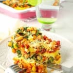 Vegetarian polenta lasagna served on a white plate.