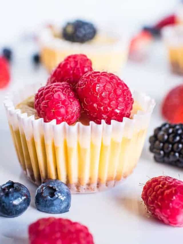 Small cheesecake cup with raspberries.