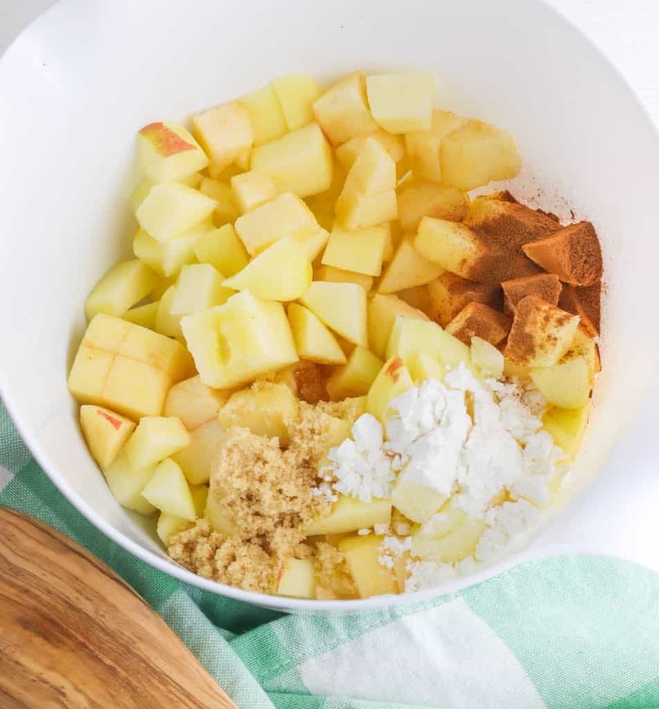 ingredients for apple crisp in a white bowl