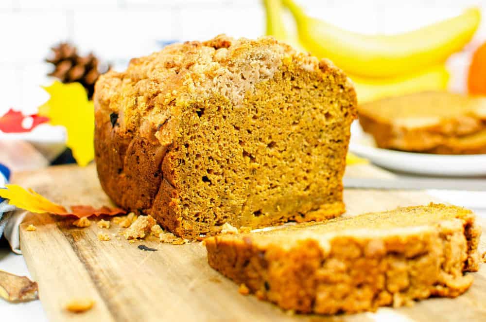 slices of gluten free coffee cake with pumpkin served on a wooden cutting board