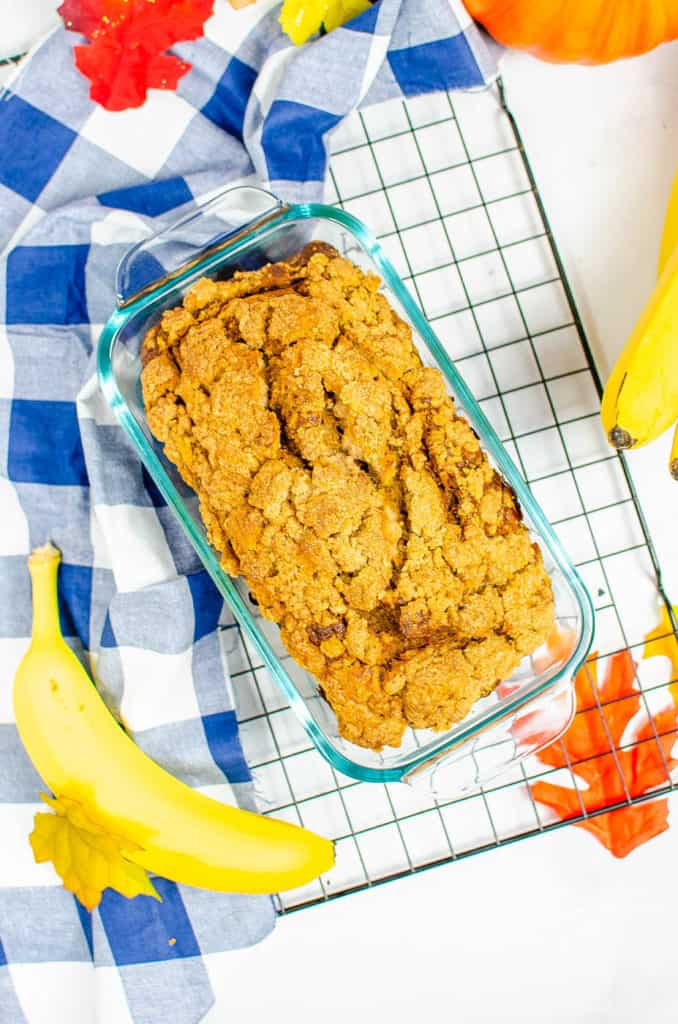 gluten free coffee cake with pumpkin, served in a baking dish on top of a baking rack