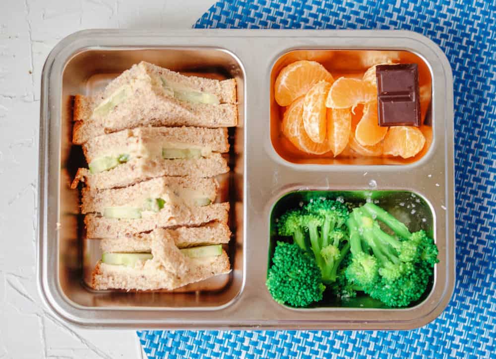 Healthy Toddler lunches - sprouted wheat sandwich with hummus, cucumbers, oranges, broccoli