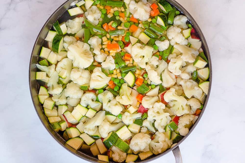 veggies steaming in a pan