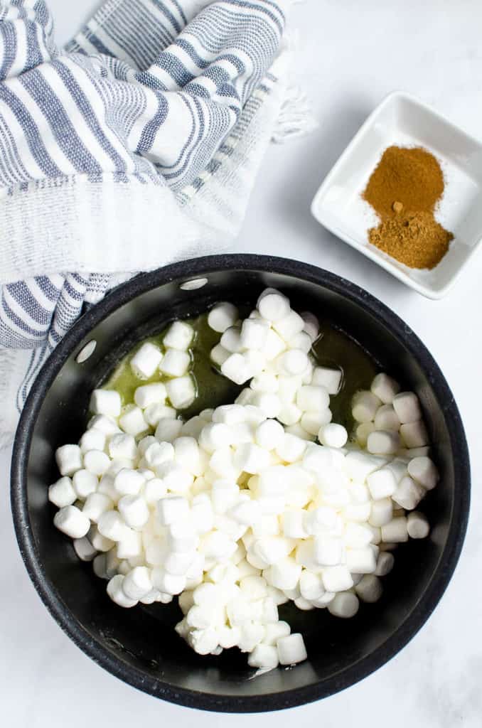 marshmallows cooking in a pot with butter