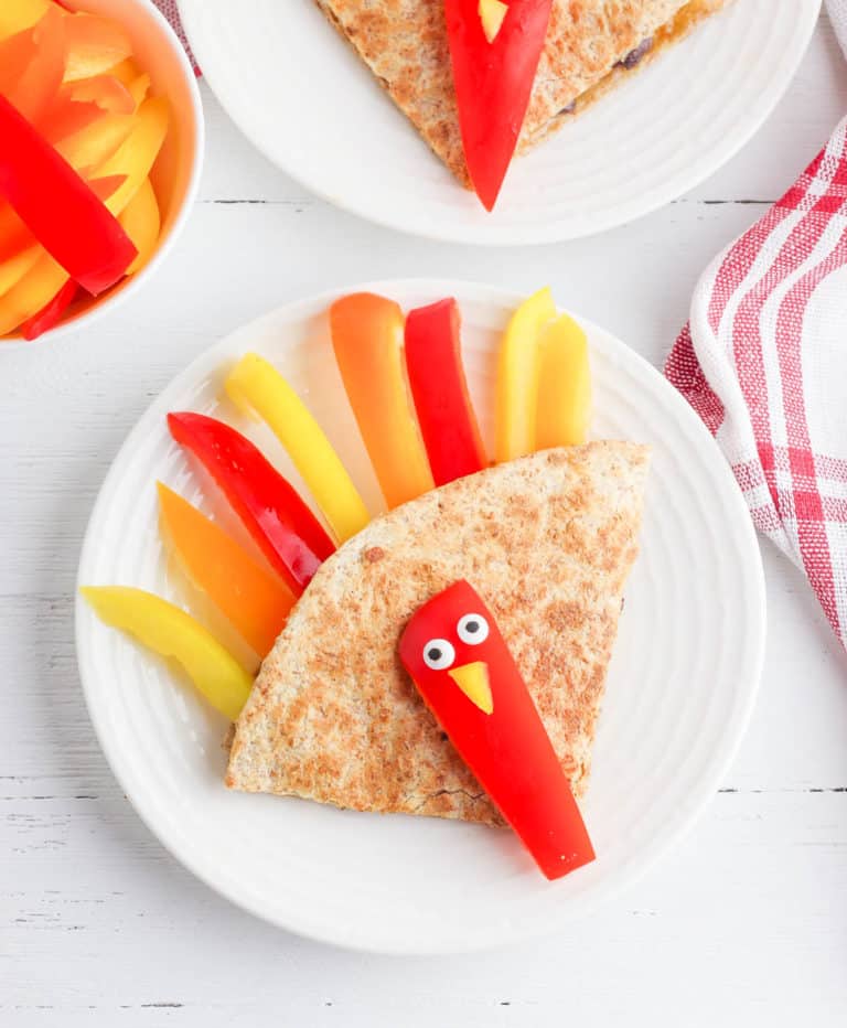 cheese quesadilla shaped like turkeys, with bell peppers, beans and cheese