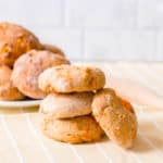 low calorie healthy biscuits made with sweet potato, stacked against a yellow and white background
