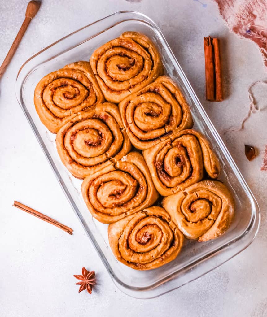 healthy cinnamon rolls fresh out of the oven in a baking pan