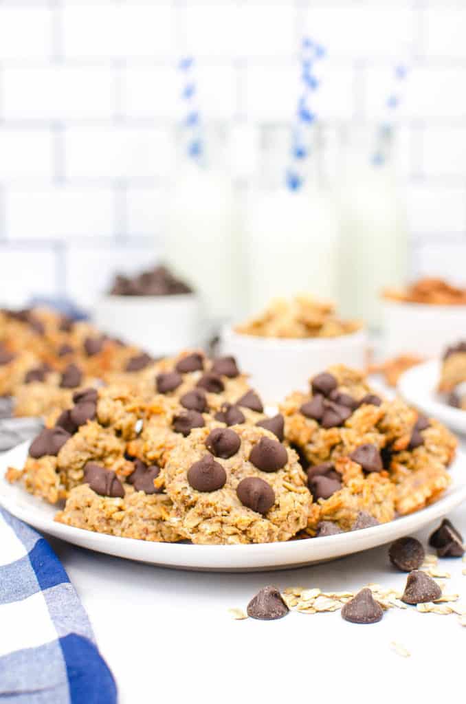 peanut butter banana oatmeal cookies served on a white plate, topped with chocolate chips
