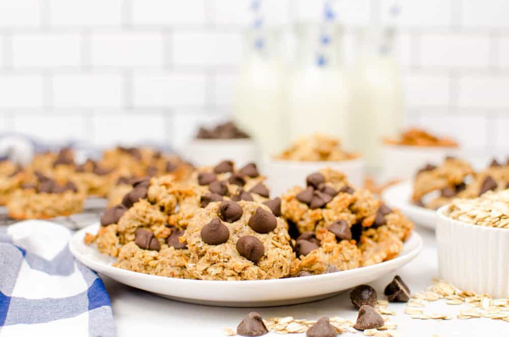 peanut butter banana oatmeal cookies served on a white plate, topped with chocolate chips