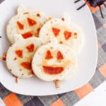 halloween jack-o-lantern pumpkin quesadillas served on a white plate