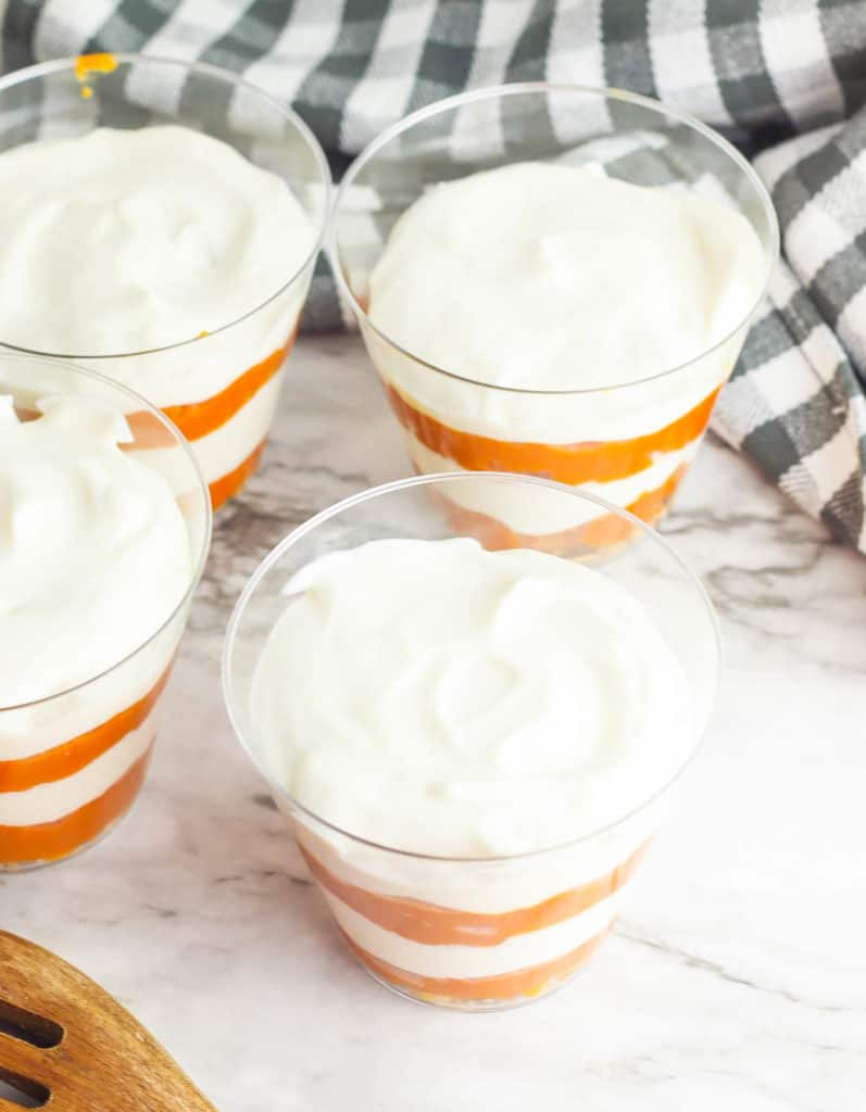 layers of pumpkin and yogurt in a glass cup