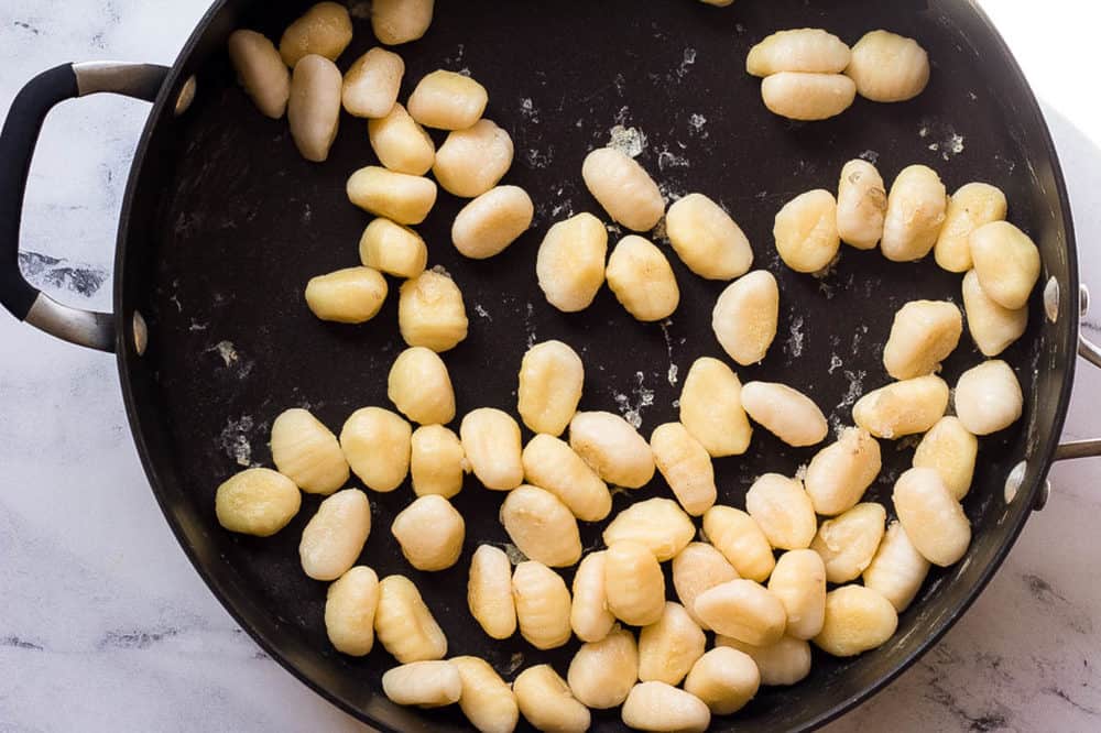 gnocchi sauteeing in a pan