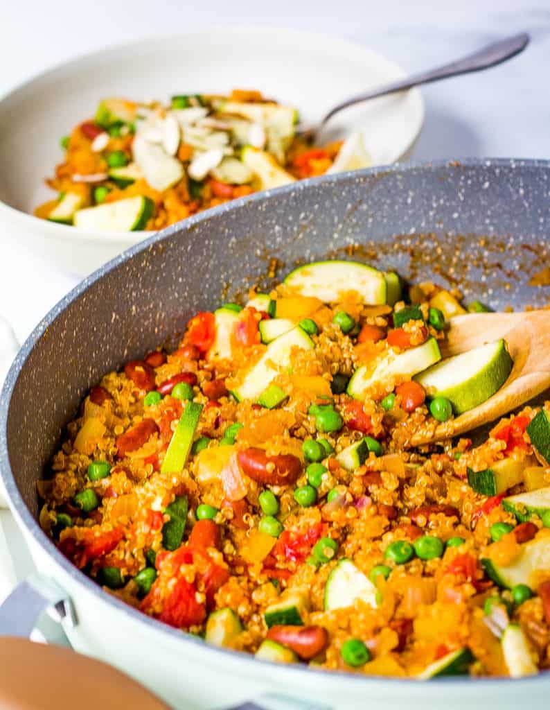 finished vegetarian paella made with fresh vegetables and quinoa