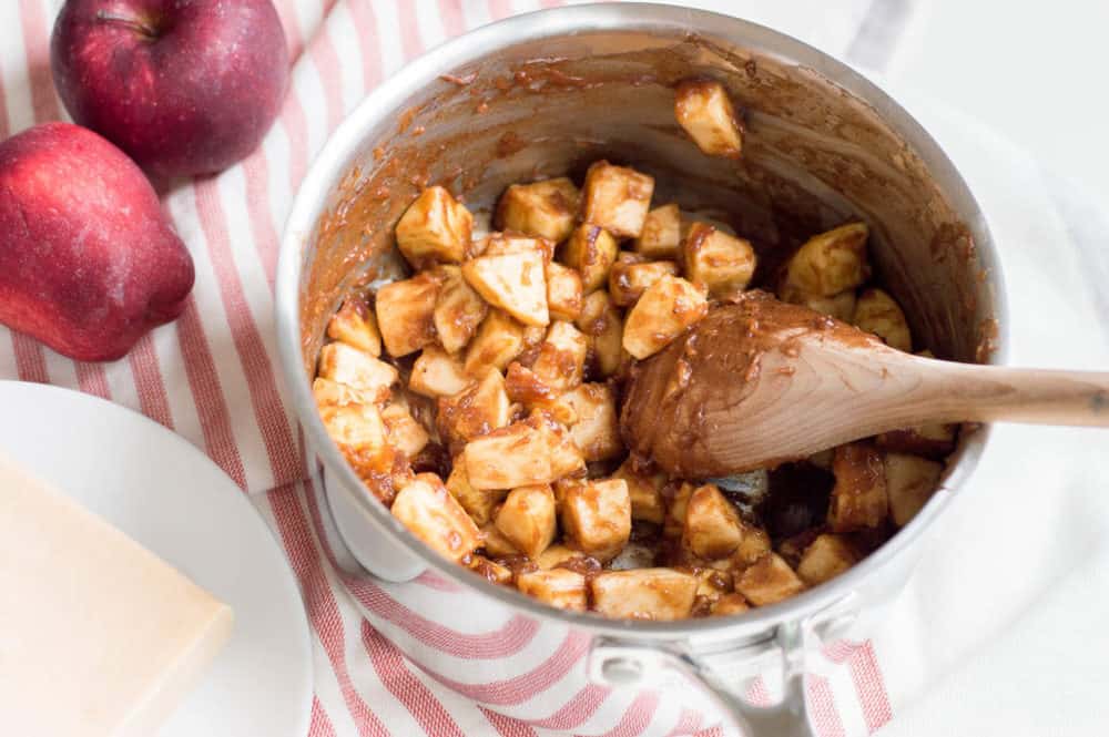 apples and spices cooking in a pot