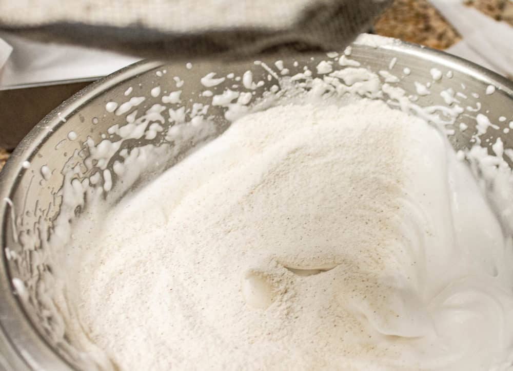 aquafaba whipped in a mixing bowl