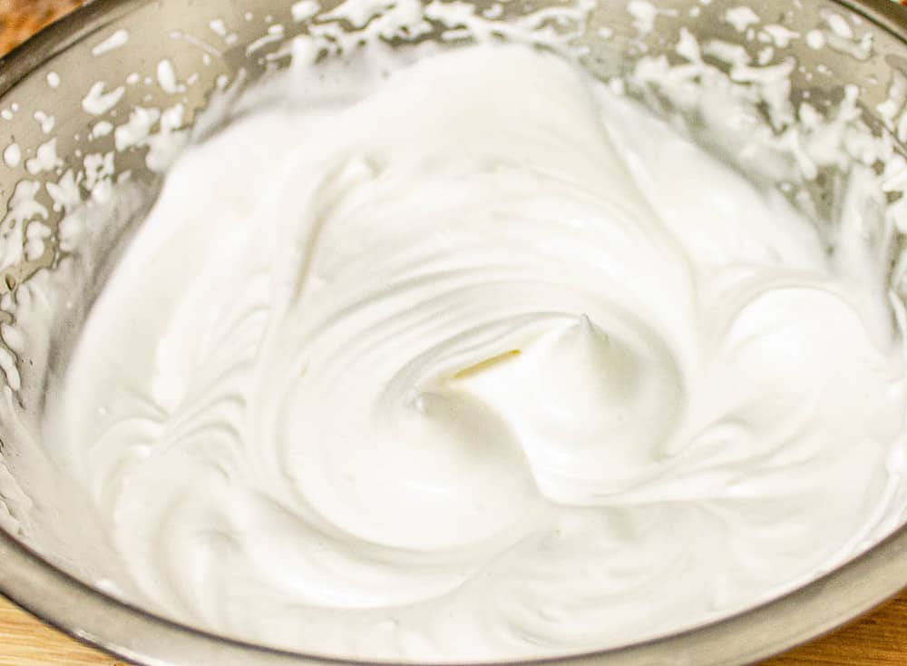 aquafaba whipped in a mixing bowl