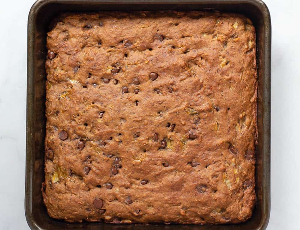 healthy chocolate chip banana bread fresh out of the oven in a baking dish