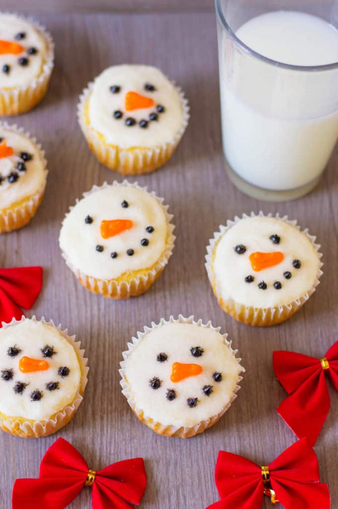 snowman cupcakes against a grey background