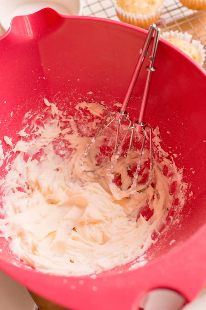 icing being made in a bowl