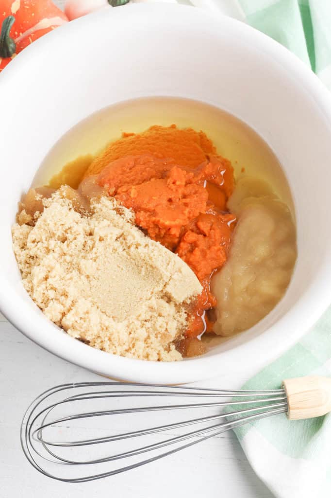 pumpkin and wet ingredients mixed in a bowl