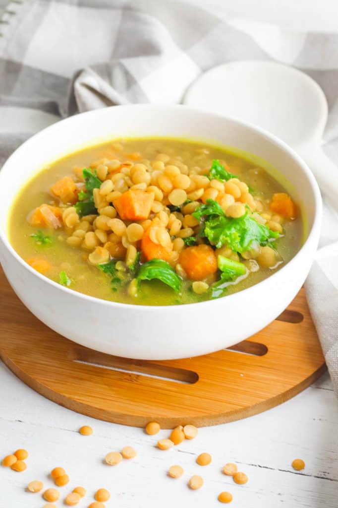 sweet potato dahl with kale, served in a white bowl