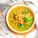 sweet potato dahl with kale, served in a white bowl