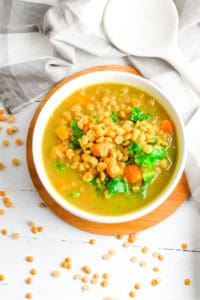 sweet potato dahl with kale, served in a white bowl