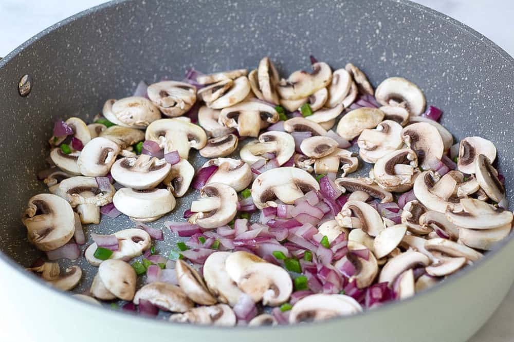 mushrooms added to pan with onions