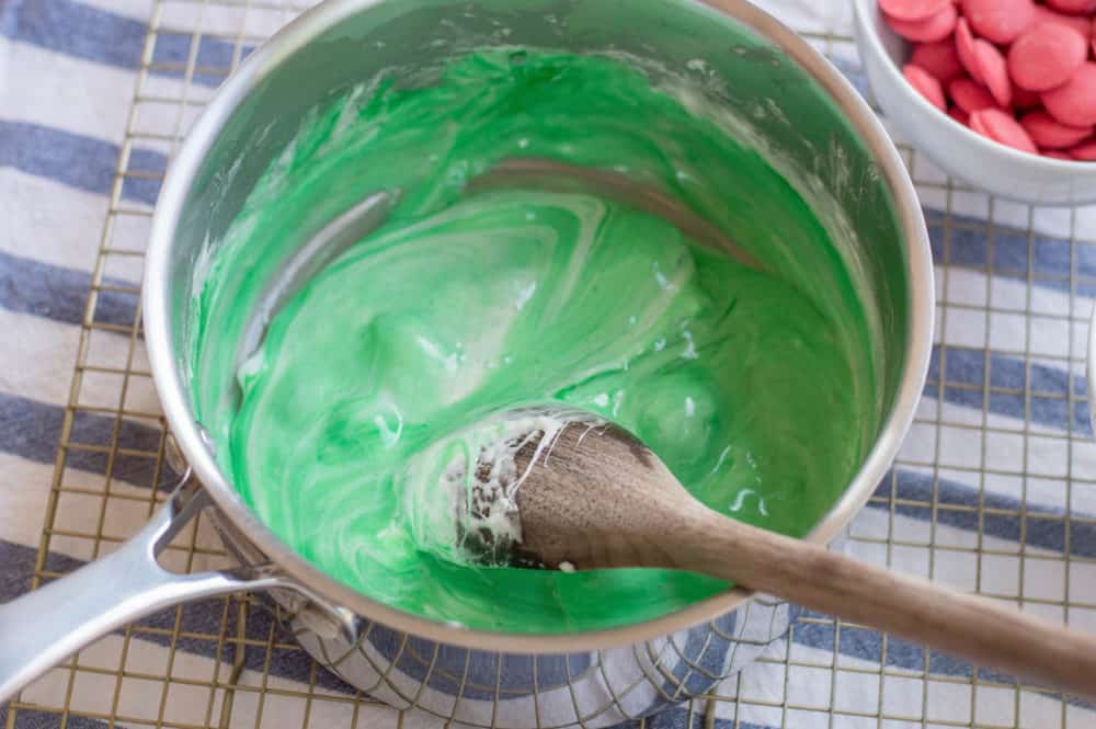 food coloring and marshmallows mixed in a pot