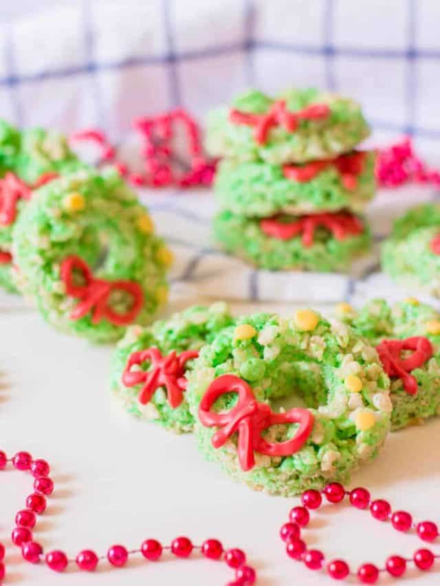 Christmas rice krispie wreaths on a counter.