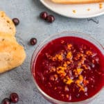 healthy cranberry sauce topped with orange zest served in a glass bowl