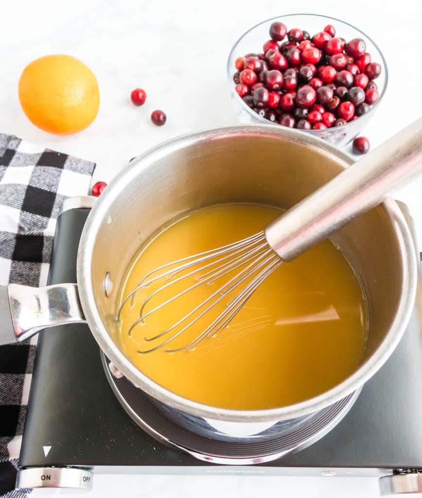 orange juice simmering in a pot