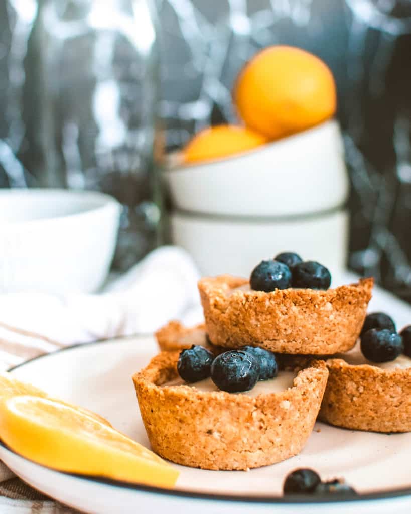 Lemon Tartlets with Coconut Milk Filling on a white plate