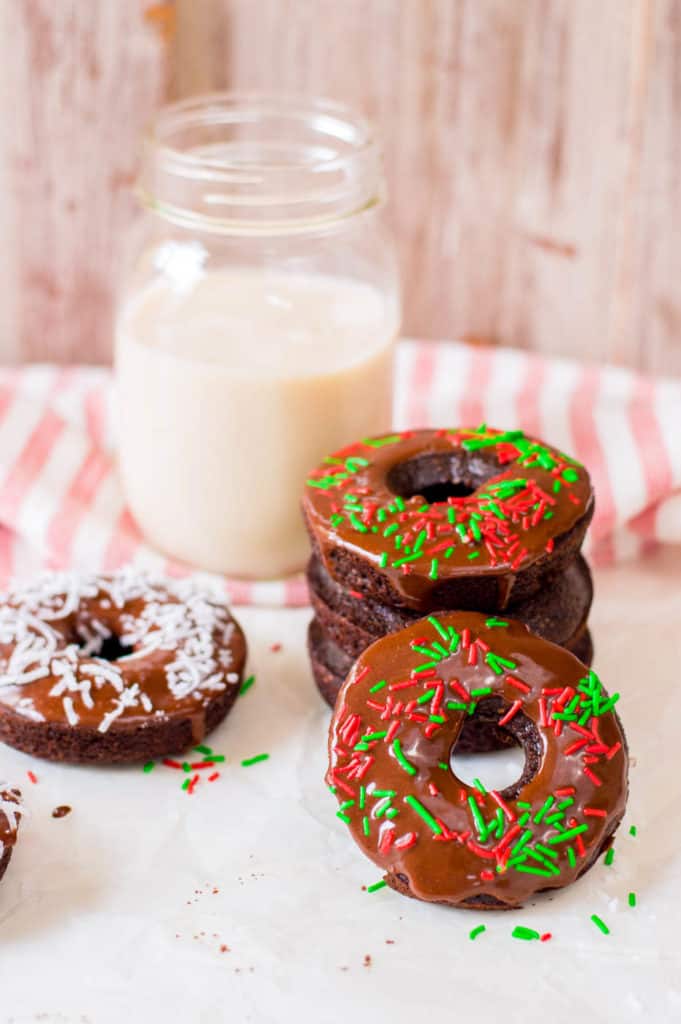 chocolate doughnuts with chocolate icing and sprinkles / coconut shreds