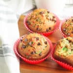 christmas muffins with chocolate chips on a wooden cutting board
