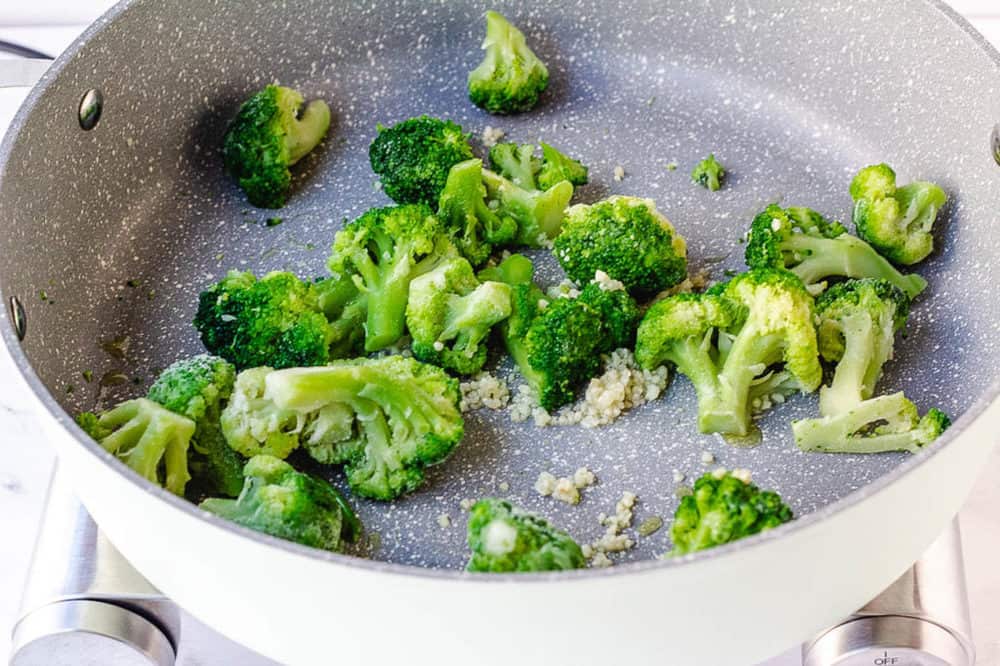 broccoli and garlic sauteeing in a pot